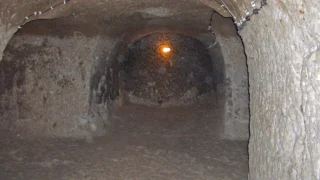 Rock-cut passage inside Derinkuyu Underground City in Cappadocia, Türkiye.