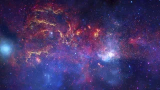 Galactic Center composite combining Hubble, Spitzer, and Chandra observations with assigned colors.