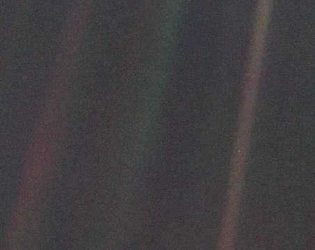 Voyager 1 Pale Blue Dot image showing Earth within scattered sunlight, February 14, 1990.