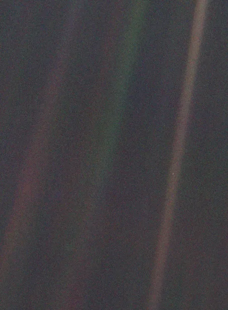 Voyager 1 Pale Blue Dot image showing Earth within scattered sunlight, February 14, 1990.