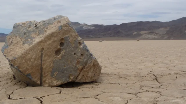 Rock and trail on Racetrack Playa in Death Valley National Park.