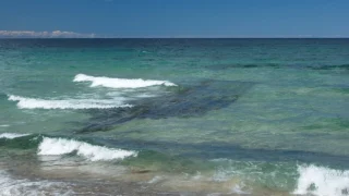 Submerged shipwreck visible from shore. Context photograph, not the newly exposed Warren Sawyer remains.